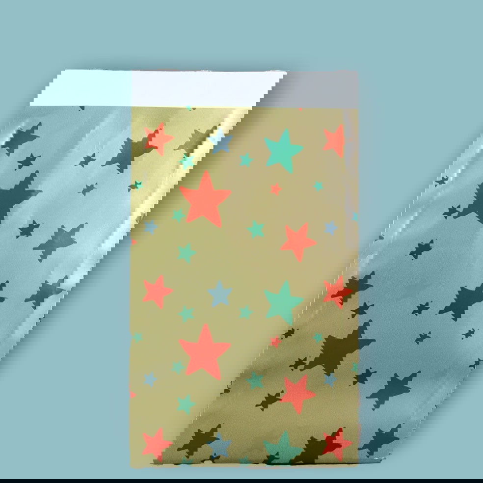 Kerst Inpakpapier Stars on Gold - Kadopapier.net